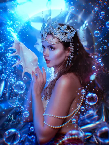 Mermaid with seashell and pearls