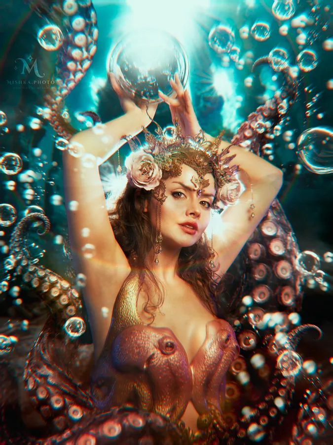 Mermaid on the beach with tail in water
